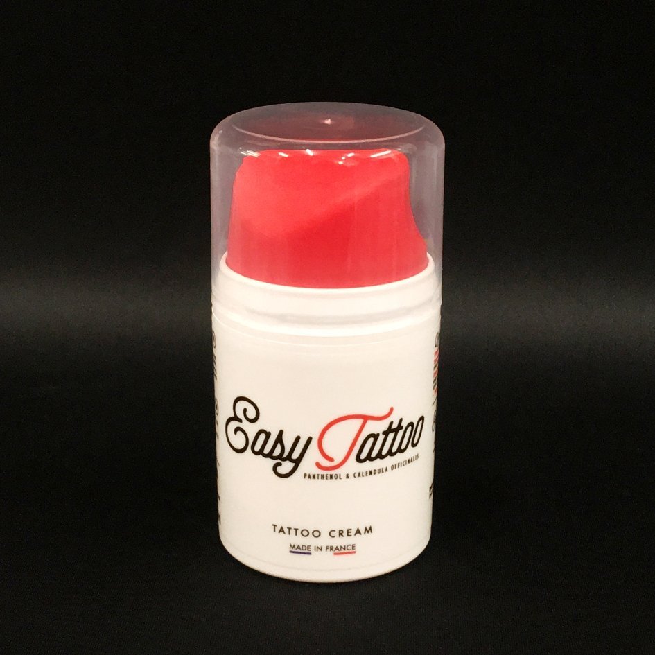 Easy Tattoo Cream with a pump dispenser and red cap. A professional tattoo aftercare cream containing panthenol and calendula to support healing and hydration. Made in France. 